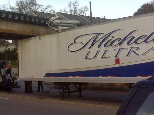 Beer truck gets stuck under Peace Street Bridge