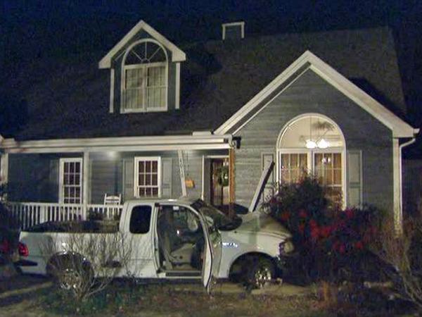 Pickup hits house; driver seriously injured