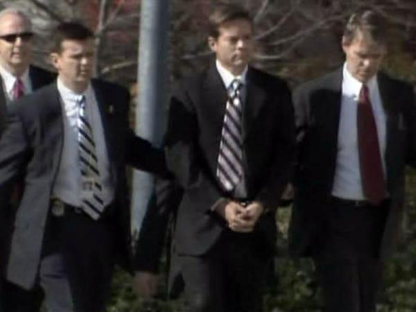 Easley's ex-aide led into courthouse in handcuffs