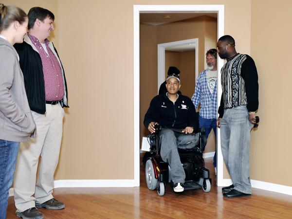 Wounded vet moves into new volunteer-built home