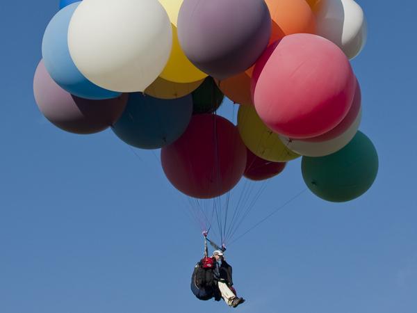 Man flies across N.C. skies in cluster balloon chair