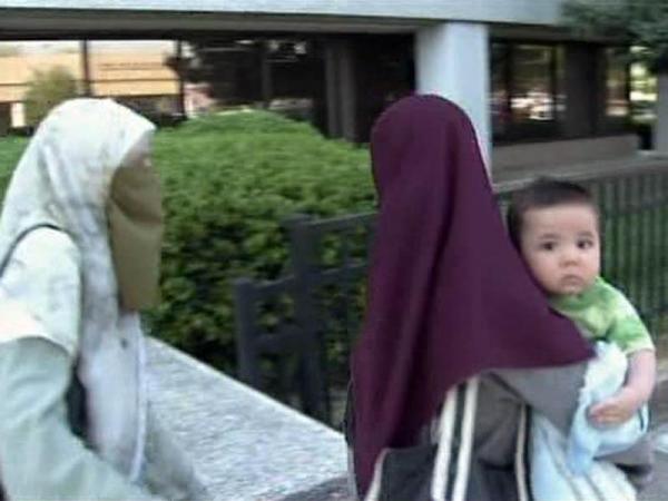 Terror suspect sees infant son in court