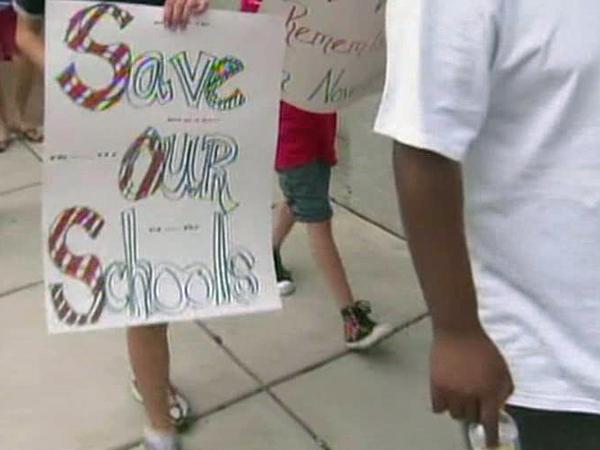 Teachers, students ask commissioners to not cut school funding