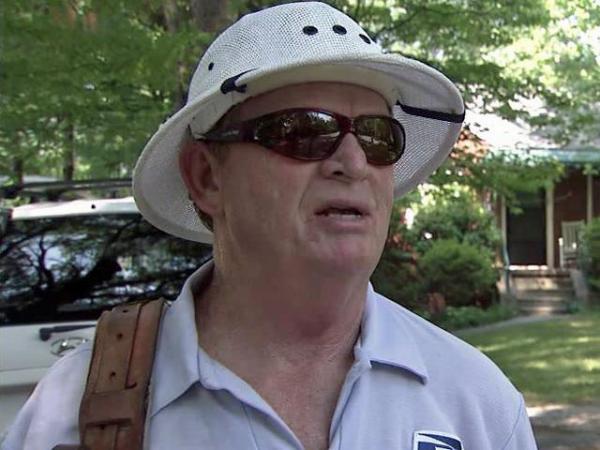 Mail carriers trudge through heat