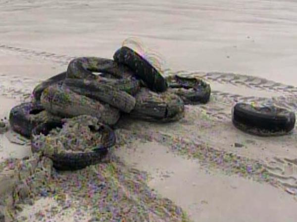 Tires, tourists found in wake of Earl
