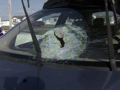 Woman hurt when brick thrown at car on highway