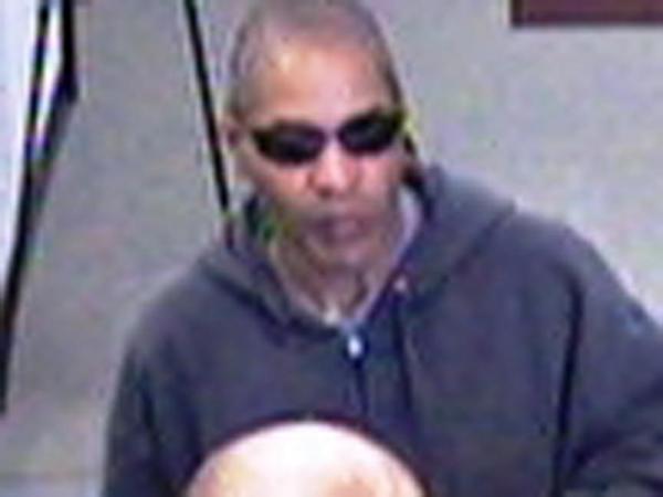 Surveillance images show the man suspected of robbing a Durham bank on April 4, 2011.