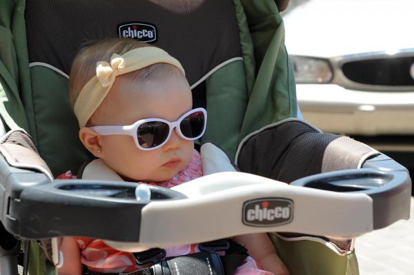 Aleyna of Fort Bragg has the right idea with her sunglasses while visiting the the annual Dogwood Festival in Fayetteville, NC on April 30, 2011. (Photo by Lance King)